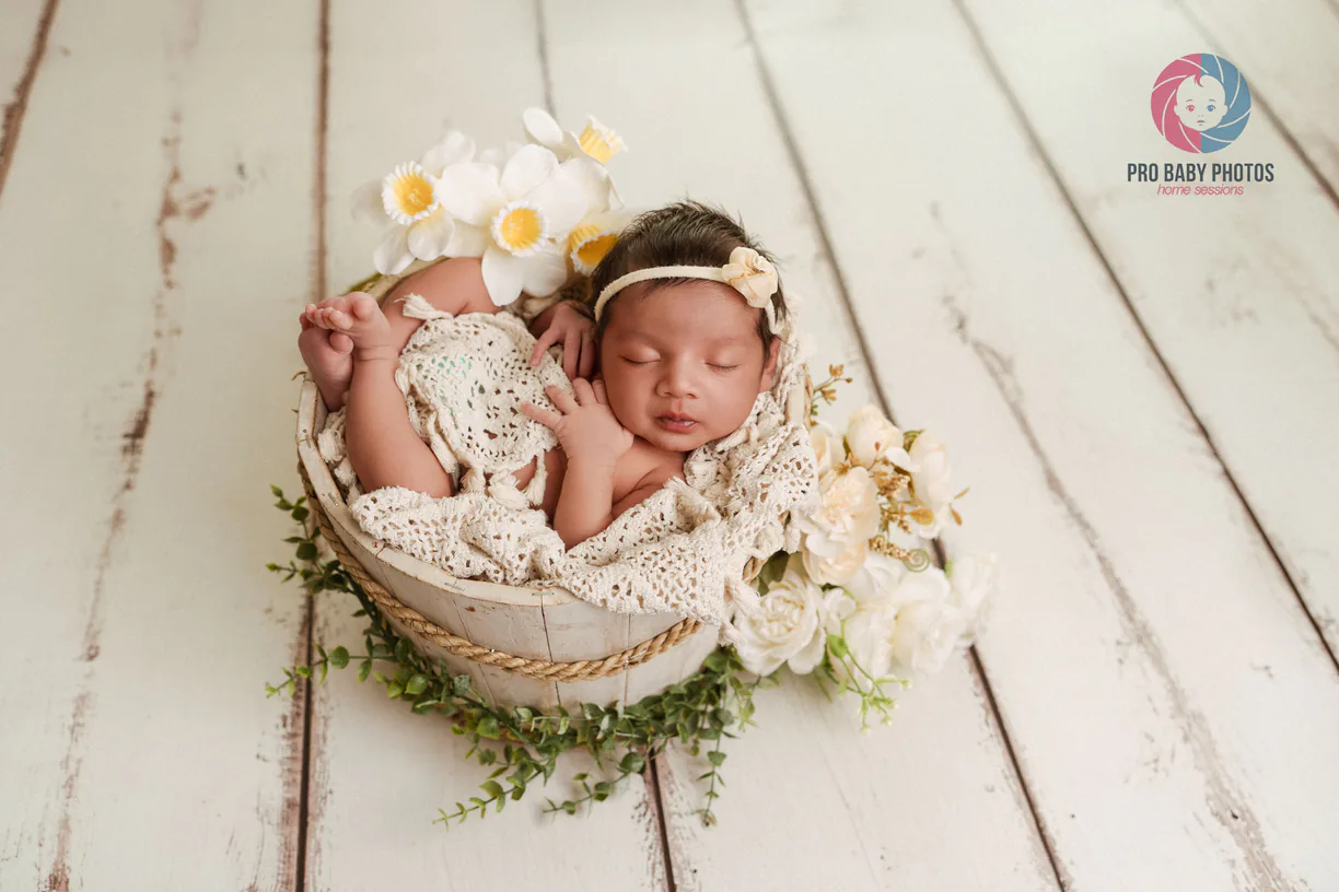 Newborn baby photographed at home with professional lighting