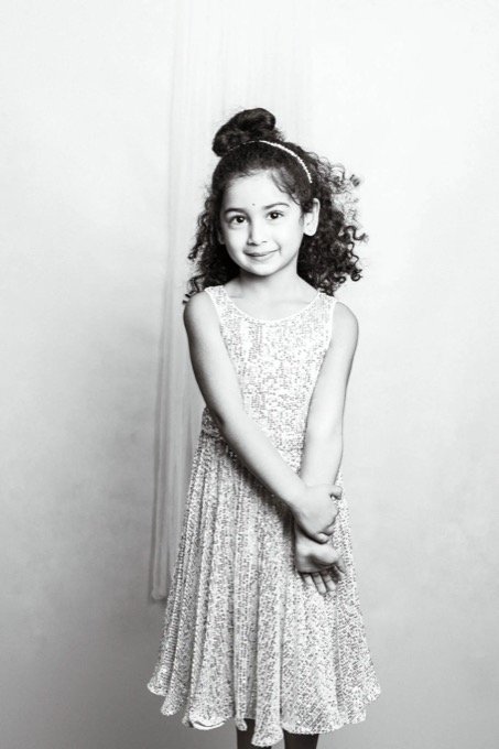 Black and white child portrait with timeless studio-style lighting