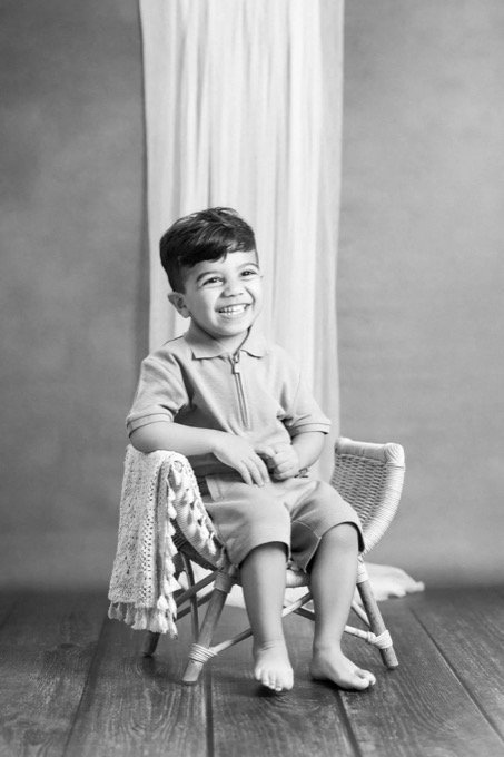Black and white family session portrait at home